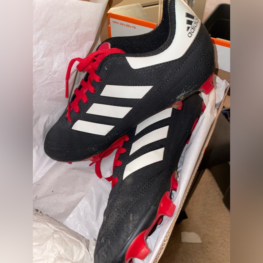 Red and black Adidas cleats size 4.5 men